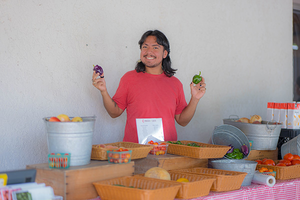 vegetable stand with worker